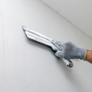 Expert wall plastering techniques demonstrated in a Sringeri construction project